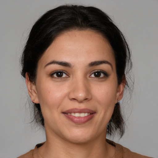 Joyful white young-adult female with medium  brown hair and brown eyes