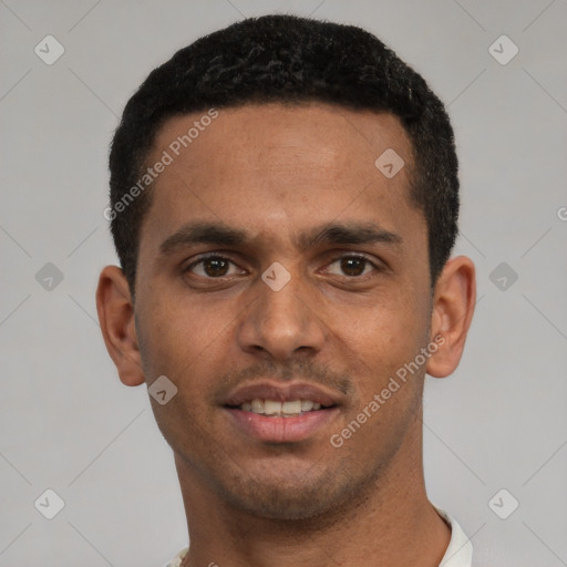 Joyful white young-adult male with short  black hair and brown eyes