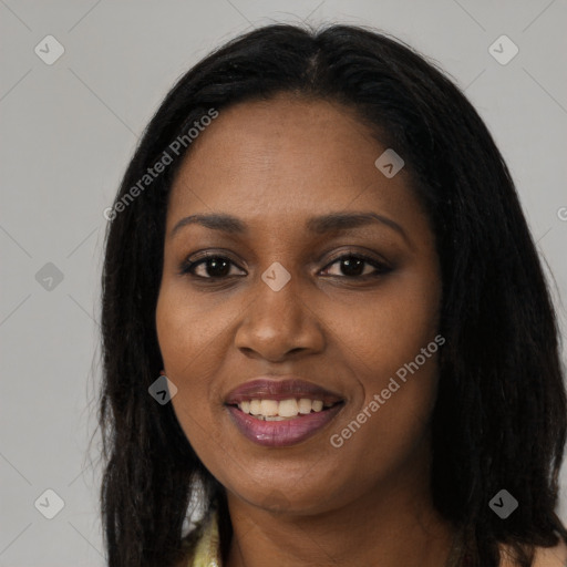 Joyful black young-adult female with long  black hair and brown eyes