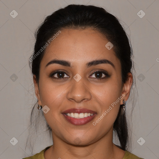 Joyful latino young-adult female with medium  brown hair and brown eyes