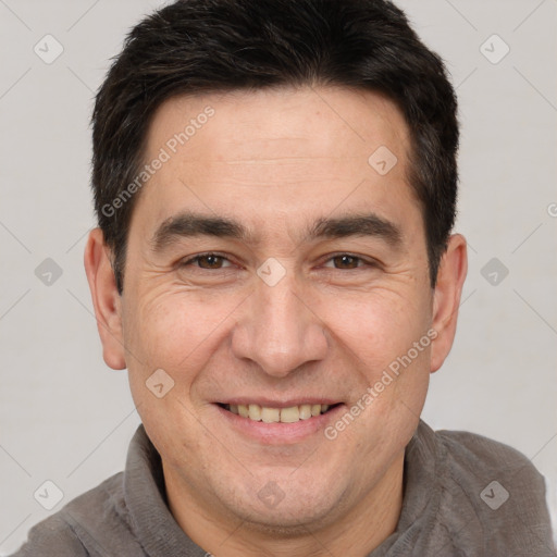 Joyful white adult male with short  brown hair and brown eyes