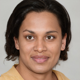 Joyful white young-adult female with medium  brown hair and brown eyes