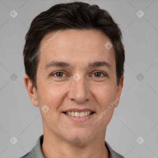 Joyful white adult male with short  brown hair and brown eyes