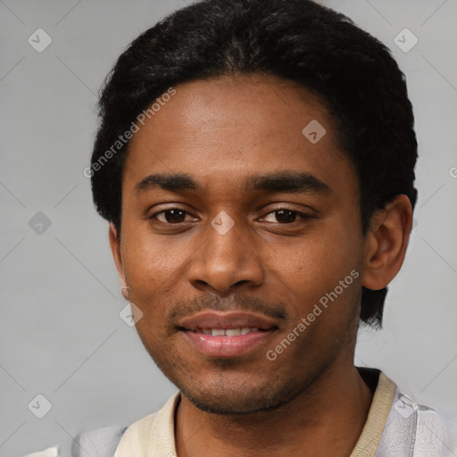 Joyful black young-adult male with short  black hair and brown eyes
