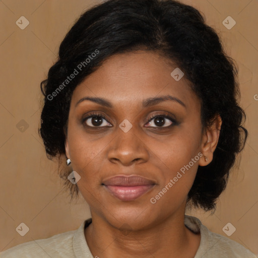 Joyful black young-adult female with medium  brown hair and brown eyes