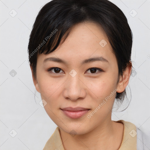 Joyful asian young-adult female with medium  brown hair and brown eyes