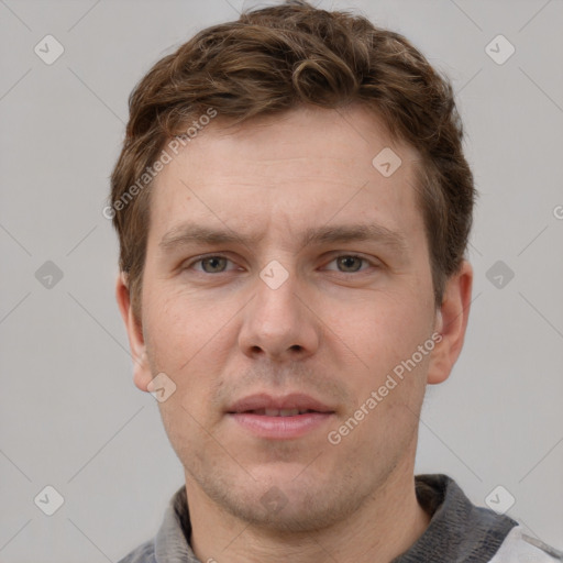 Neutral white young-adult male with short  brown hair and grey eyes