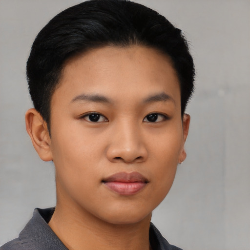 Joyful asian young-adult female with short  black hair and brown eyes