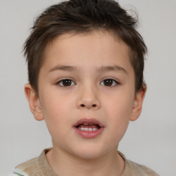 Joyful white child male with short  brown hair and brown eyes