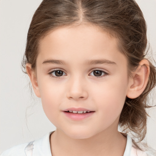 Joyful white child female with medium  brown hair and brown eyes