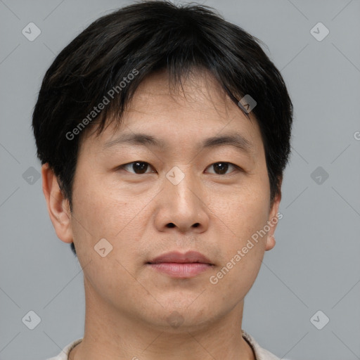 Neutral asian young-adult male with short  brown hair and brown eyes