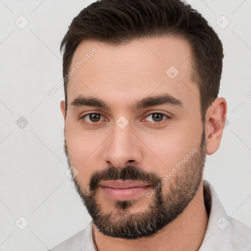 Neutral white young-adult male with short  brown hair and brown eyes