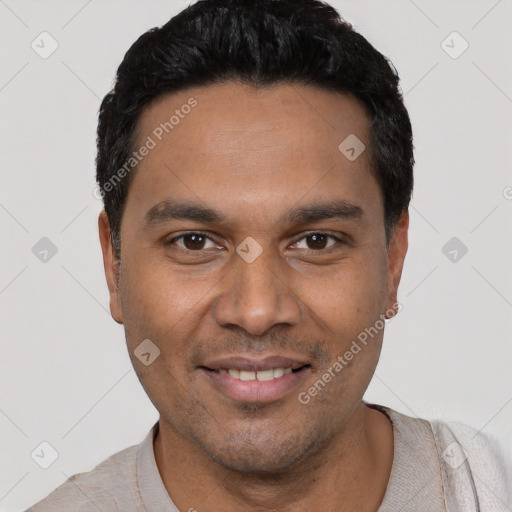 Joyful white young-adult male with short  black hair and brown eyes