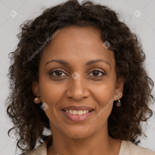 Joyful black young-adult female with medium  brown hair and brown eyes