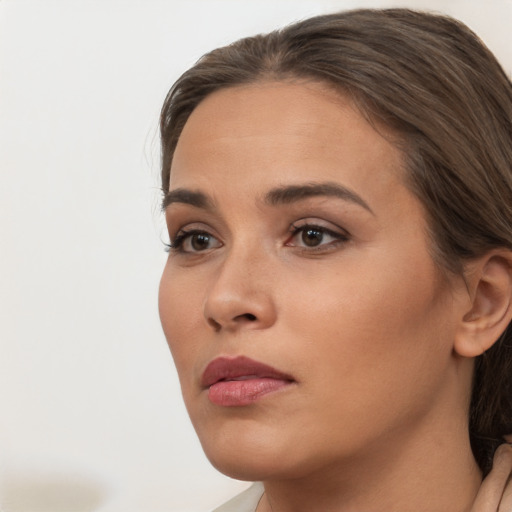 Neutral white young-adult female with long  brown hair and brown eyes