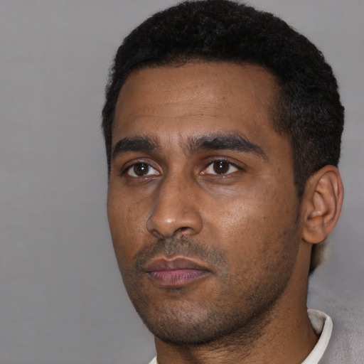 Neutral black young-adult male with short  black hair and brown eyes