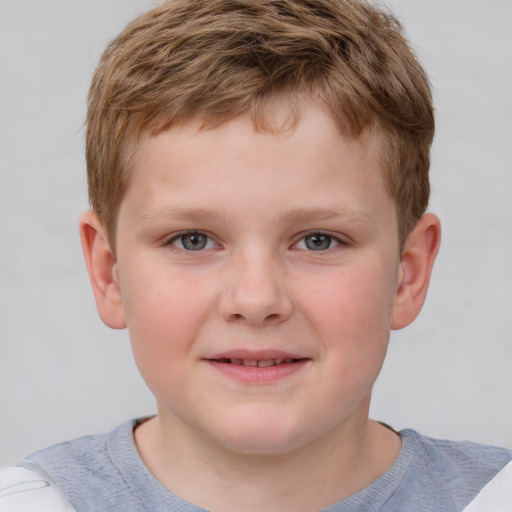 Joyful white child male with short  brown hair and grey eyes