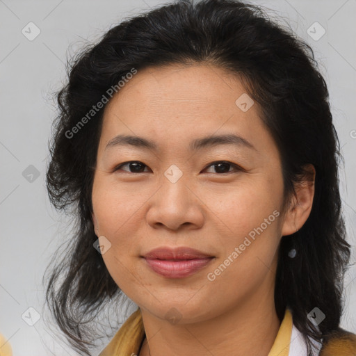 Joyful asian adult female with medium  brown hair and brown eyes