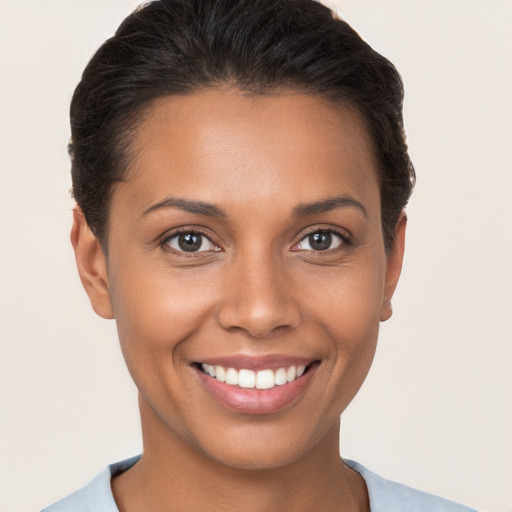 Joyful white young-adult female with short  brown hair and brown eyes