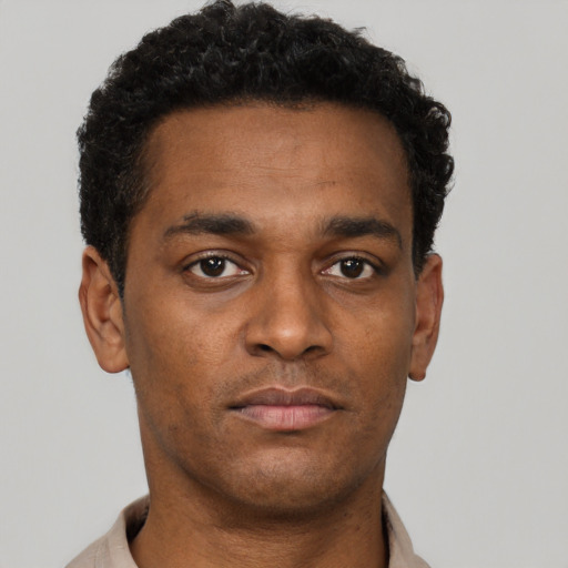 Neutral black young-adult male with short  brown hair and brown eyes