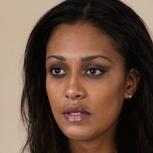 Neutral black young-adult female with long  black hair and brown eyes