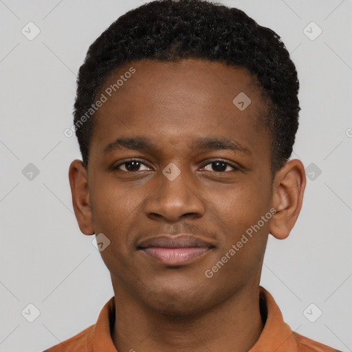 Joyful black young-adult male with short  brown hair and brown eyes
