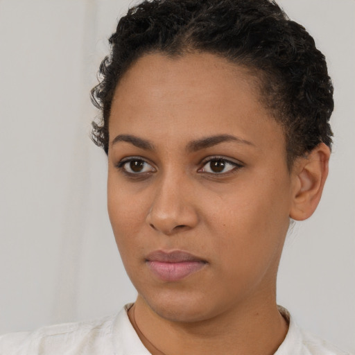 Neutral latino young-adult female with short  black hair and brown eyes