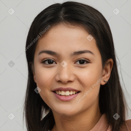 Joyful asian young-adult female with long  brown hair and brown eyes