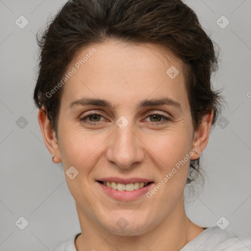 Joyful white adult female with short  brown hair and brown eyes