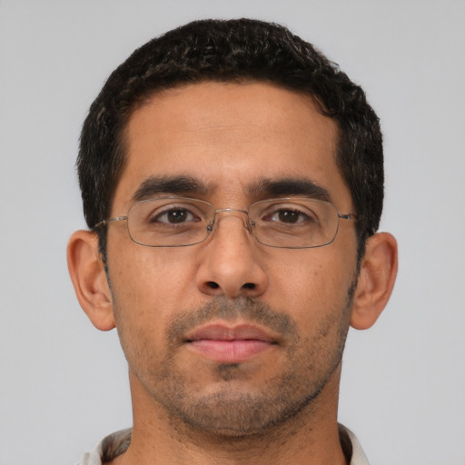 Neutral latino young-adult male with short  black hair and brown eyes