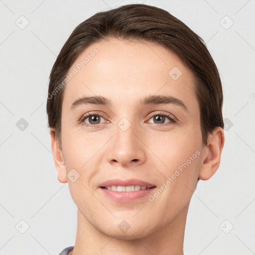 Joyful white young-adult female with short  brown hair and brown eyes