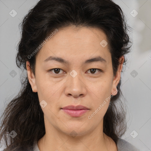 Joyful white adult female with medium  brown hair and brown eyes