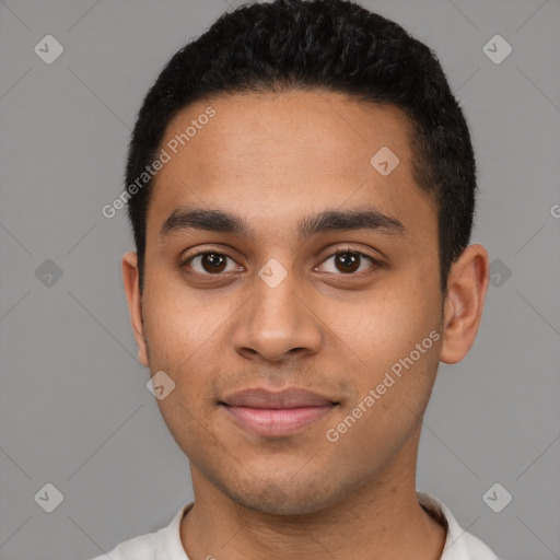 Joyful latino young-adult male with short  black hair and brown eyes