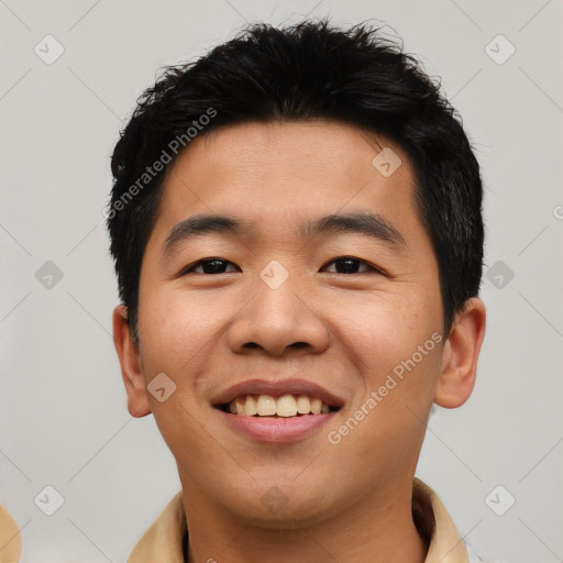 Joyful asian young-adult male with short  black hair and brown eyes