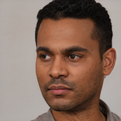 Neutral latino young-adult male with short  black hair and brown eyes