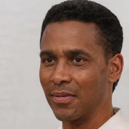 Neutral black adult male with short  black hair and brown eyes