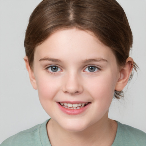 Joyful white child female with medium  brown hair and brown eyes