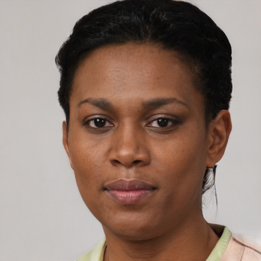 Neutral black young-adult female with short  black hair and brown eyes