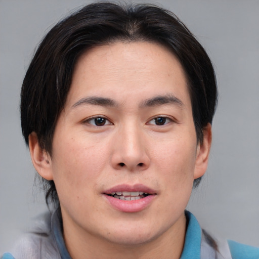 Joyful asian young-adult male with medium  brown hair and brown eyes