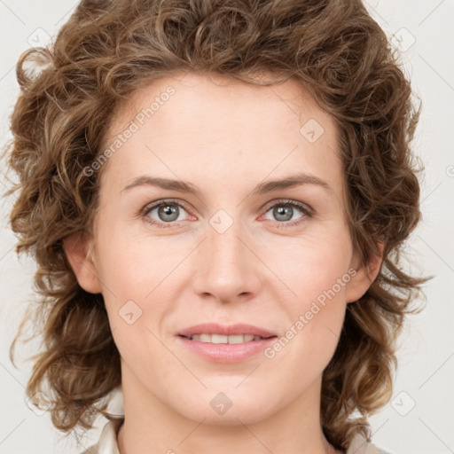 Joyful white young-adult female with medium  brown hair and green eyes