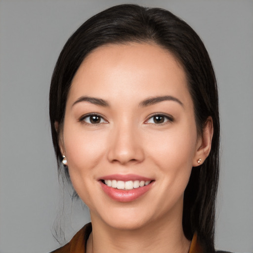 Joyful white young-adult female with long  black hair and brown eyes