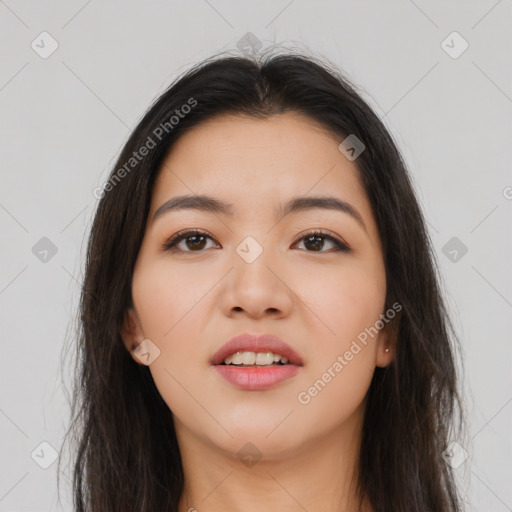 Joyful asian young-adult female with long  brown hair and brown eyes