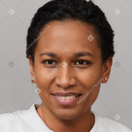 Joyful black adult female with short  black hair and brown eyes