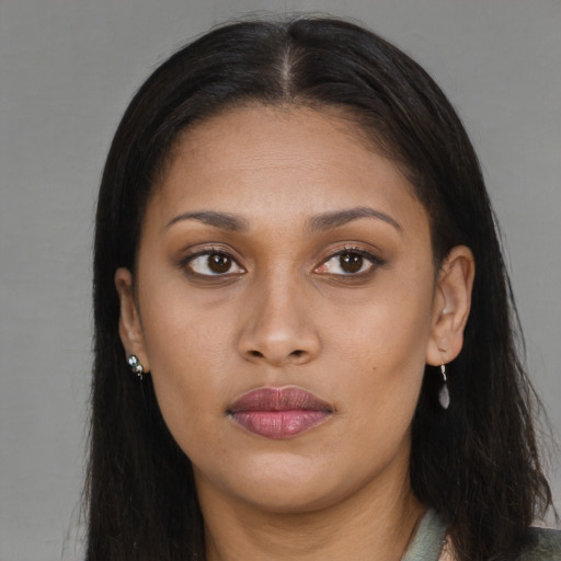 Joyful white young-adult female with long  brown hair and brown eyes