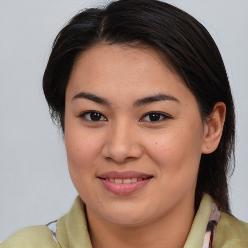Joyful asian young-adult female with medium  brown hair and brown eyes
