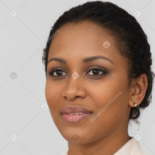 Joyful black young-adult female with medium  brown hair and brown eyes