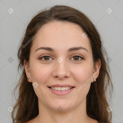 Joyful white young-adult female with long  brown hair and green eyes