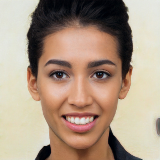 Joyful latino young-adult female with long  black hair and brown eyes