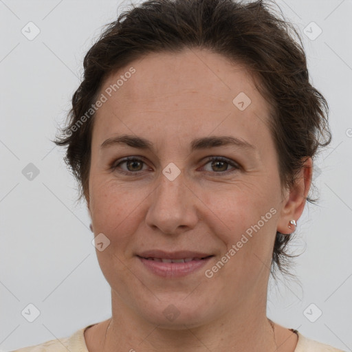 Joyful white adult female with short  brown hair and brown eyes