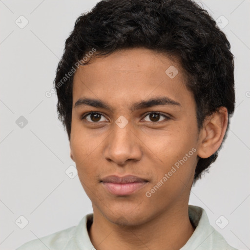 Joyful latino young-adult male with short  brown hair and brown eyes